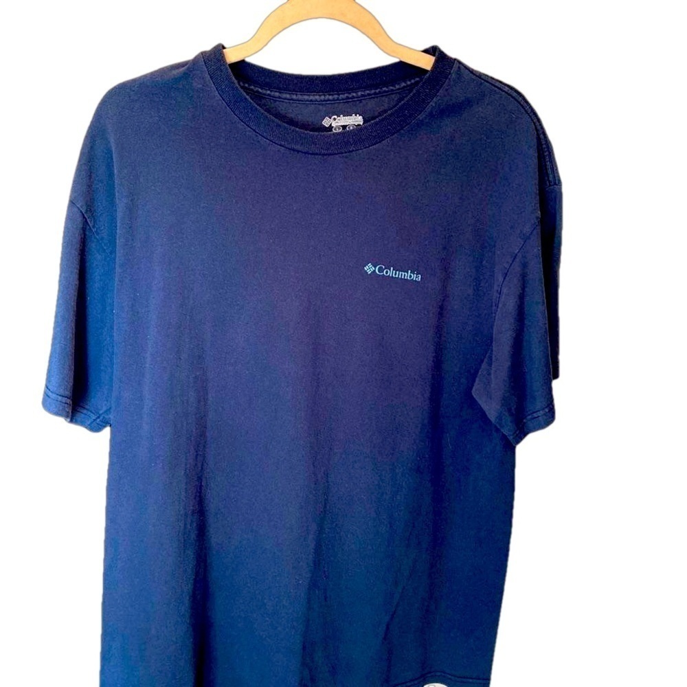 Columbia Navy T with baby blue graphics on back. Size L